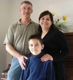 Image of FORMATION - John and Lupita Sorich look forward to the First Communion of their son Michael. Parents of 11 children, the Soriches pray regularly with their children and teach them the wonder of Christ's presence in the Eucharist. 