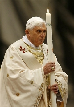 Image of Pope Benedict XVI holds a candle during the Easter vigil mass in St. Peter's Basilica, at the Vatican, Saturday March 22, 2008. The pontiff presided over an Easter vigil service late Saturday during which he was to baptize one of Italy's most prominent Muslims. The pope traditionally imparts the sacrament of baptism to several adults during the solemn vigil service, which marks the period between Good Friday, which commemorates Jesus' crucifixion, and Easter Sunday, which marks his resurrection.