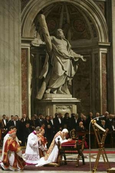 Image of Pope Benedict XVI prays during a Good Friday mass at Saint Peter's Basilica at the Vatican March 21, 2008. Pope Benedict reflected on the persecution of Catholics across the world during a Good Friday procession around Rome's Colosseum that threw the spotlight on suffering among China's faithful. The Pope, who has made improving relations with China one of the goals of his pontificate, presided over the traditional Via Crucis (Way of the Cross) procession commemorating Christ's crucifixion and death.