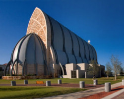 Image of Ave Maria Oratory. The 1,100-seat landmark church building that's 104 feet tall and topped with a 10-foot Celtic cross.