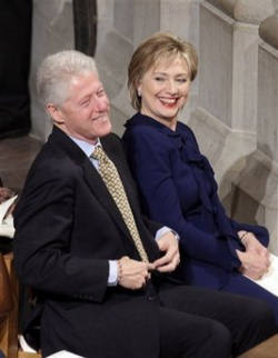 Image of Secretary of State-designate Hillary Rodham Clinton is seen with her husband, former President Bill Clinton before the inaugural prayer service at the Washington National Cathedral in Washington, Wednesday, Jan. 21, 2009. The Senate has confirmed Hillary Rodham Clinton to become secretary of state.