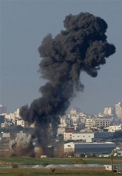 Image of A cloud of smoke rises following an Israeli missile strike in the northern Gaza Strip, Friday, Jan. 2, 2009. Israel showed no sign of slowing a blistering seven-day offensive against Hamas militants in Gaza, destroying homes of the group's leaders and bombing one of its mosques a day after a deadly strike on a prominent Hamas figure killed him and most of his family.