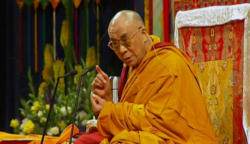 Image of Speaking before a crowd of thousands in the city where his government has found exile, the Dalai Lama recalled 
