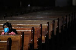 Image of Cardinal Norberto Rivera, the archbishop of Mexico City, asked that priests suspend all Masses without exception Sunday. The move is without precedent in the city and surrounding municipalities, which has a total population exceeding 22 million.