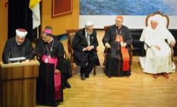 Image of Pope Benedict XVI, center, listens along with Rabbi Shear Yashuv Cohen, left, Cardinal Tarcisio Bertone, second left, Latin Patriarch Fouad Twal, second right, and Sheikh Taysir Tamimi during an interfaith gathering at the Notre Dame Center in Jerusalem, Monday, May 11, 2009. 
<br>Photo: AP