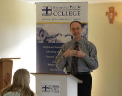 Image of (Pictured. Dr. C.S. Morrissey teaching students at Redeemer Pacific College.)Catholic universities are thus better characterized as 'faith-and-reason'-based, since their institutional reason for existence is to provide a mediating, ecumenical role between human reason and particular faiths. 