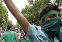 Image of Over the past two days groups of protesters have gathered around the University Campus in Teheran and along the streets of the capital shouting slogans in favour of Moussavi, and 'down with dictatorship' throwing stones at riot police.