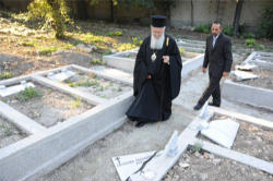 Image of (Photo: Nikos Manginas) Outraged and grieved by what happened, the Ecumenical Patriarch Bartholomew (pictured) went to see the desecrated cemetery, asking why such acts continue to strike Christian graveyards.
