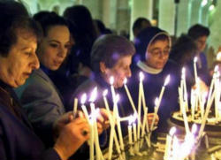 Image of Palestinian Christians pray for peace.