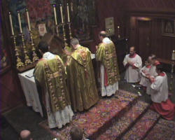 Image of (An 'Anglican Use' Liturgy being celebrated) The Liturgy, a part of the Roman Catholic Church, includes the celebrants and deacons 'facing east', a more formal use of the English, and a structure which involves an Anglican liturgical 'flavor', all with the official approval of Rome.