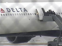 Image of Passengers exiting Delta Flight #253 after an emergency landing.