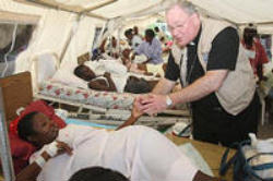 Image of New York Archbishop Timothy Dolan led hundreds of Haitians in a funeral Mass at the ruins of the Notre Dame Cathedral in Port-au-Prince, Haiti on Saturday.