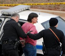 Image of Police take Biology Professor Amy Bishop, 42, into custody after shootings during a tenure meeting at the University of Alabama-Huntsville.
