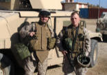Image of (Photo furnished by the Department of Defense) Fr. Duesterhaus with RP and Tank in Iraq.