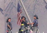 Image of Brave Firefighters raise the flag at Ground Zero