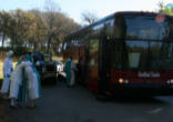 Image of Intercessors of the Lamb getting on the bus as they leave their former residence at the direction of the Bishop.