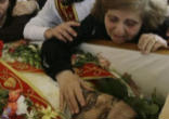 Image of Iraqi Christians mourning the loss of one of their beloved priests killed by Muslim extremists