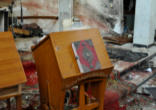 Image of The Book of the Gospels used during the Divine Liturgy survived the brutal attack and bombing of Our Lady of Deliverance Church