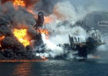 Image of Deepwater Horizon offshore drilling platform sinks into the Gulf.