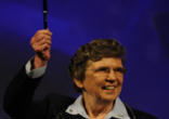 Image of Sr Carol Keehan, the controversial President of the Catholic Hospital Association, waiving the pen she received when she attended the signing of the Health Care Act.