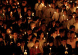 Image of Catholics participating in the Easter Vigil. Credit: Mazur