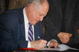 Image of Governor Quinn signing the Illinois civil unions law on Jan. 31, 2011. Photo taken from Chicagopride.com, by Anthony Meade
