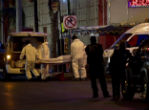 Image of Mexican authorities remove the victims of a grenade attack in Monterrey, Mexico where at least 30 people have been killed.