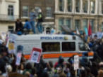 Image of Overwhelmed London police are being reinforced tonight by up to 16,000 officers to quell the riots.