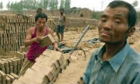 Image of This file photo from 2007 shows men reportedly working as slaves in a Chinese brick kiln. Despite rescues, the problem is widespread.
(NEWS CONSORTIUM, 2007)