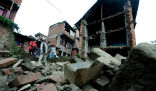Image of Quake survivors survey damage.