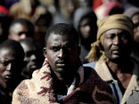 Image of North African refugees are settling in makeshift camps, fearing for their safety and future.