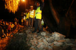 Image of Nepalese rescue workers at the site of the collapse at the British Embassy in Nepal where thee people were killed. 