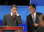 Image of Perry and Romney enjoy a laugh at the Republican Presidential Debate in Orlando, Florida on Thursday.