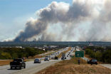 Image of Thousands of people have been displaced by the fires which have burned near the edge of several cities and towns in Texas.