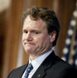 Image of B of A CEO Brian Moynihan, is hoping customers accept the new fees on debit card use.