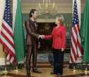 Image of Mutassim Gaddafi and Hillary Clinton.