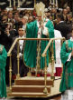 Image of Pope Benedict on his new moving platform which allows him to conserve his strength during services.