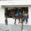 Image of Haitian jails are so overcrowded, that many cannot lie down at night.