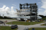 Image of Shuttle Discovery being removed from a specially modified 747 after ferrying from California in this NASA file photo.