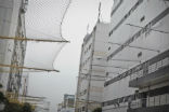 Image of Suicide nets at the Foxconn factory in China where Apple products are assembled. 