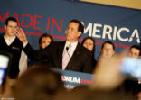 Image of A victorious Rick Santorum addresses a crowd