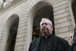 Image of The embattled Monsignor Lynn leaves a Philadelphia courthouse. 
