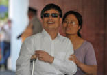 Image of Chen and his wife at airport