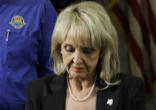 Image of Governor Jan Brewer signing legislation
