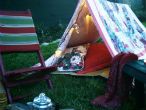 Image of A backyard tent can be improvised and setting it up is part of the fun!