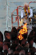 Image of Senior-citizen athlete and veteran Olympian Austin Playfoot reignites the Olympic flame. 