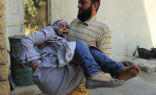 Image of A member of the Free Syrian Army carries a wounded civilian away from immediate danger. Civilians are receiving little to no medical care for lack of doctors and medicine.