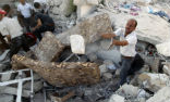 Image of Civilians must clear rubble and search for survivors without the aid of heavy equipment. 