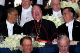 Image of Cardinal Dolan between Obama and Romney