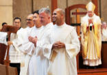 Image of Fathers Manuel Bravo, Chan Woo Lee, Eben MacDonald and Nabor Rios turn to the assembly gathered for their ordination to the priesthood June 2. VICTOR ALEMAN

